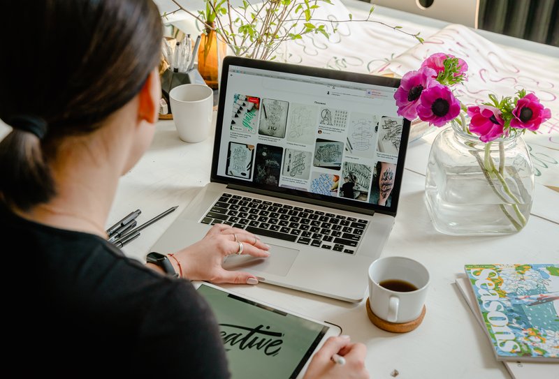 person-using-macbook-pro-beside-white-ceramic-mug-on-white-4348404.jpg